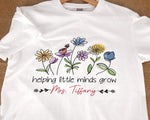 Load image into Gallery viewer, Custom Name Teacher T-shirt Helping Little Minds Grow Flower Teaching Educator Shirt Appreciation 1st Day Back To School Gift Unisex Tee